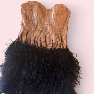 La Femme Nude and Black Feathered Cocktail Dress